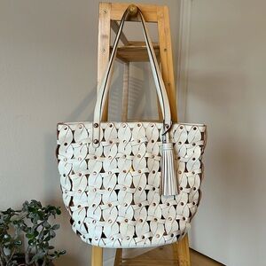 Patricia Nash braided leather shoulder tote in white and rose gold.